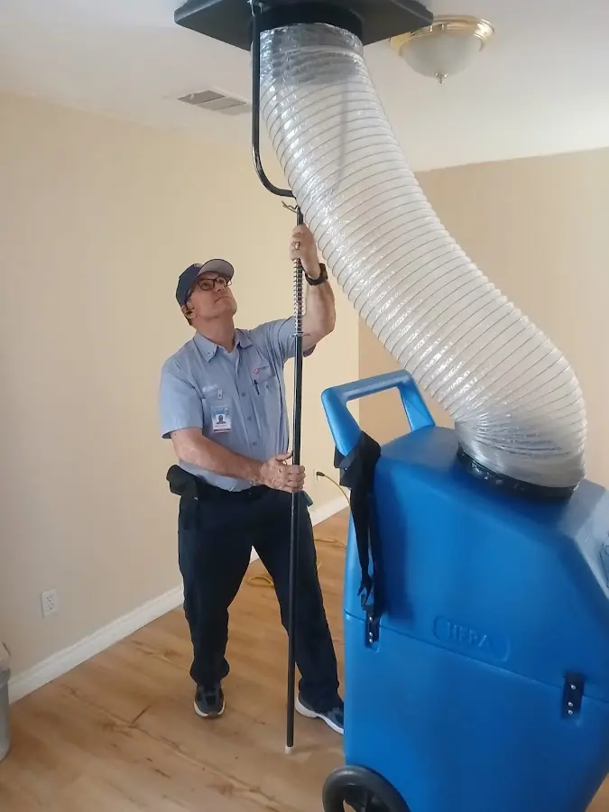 Furnace Tune-Up technician using HEPA equipment in Hazel Park